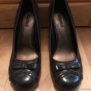 Brown heels with nice details and bow in front